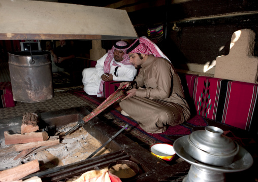 Portrait of a saudi man under a tent, Al-Jawf Province, Sakaka, Saudi Arabia