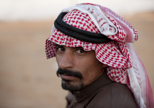 Portrait of a saudi man wearing a keffiyeh, Al-Jawf Province, Sakaka, Saudi Arabia