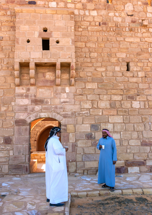 Saudi men at the entrance of the old ottoman fort from hijaz railway, Al Madinah Province, Al-Ula, Saudi Arabia