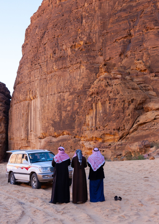 Saudi men praying in the desert, Al Madinah Province, Al-Ula, Saudi Arabia