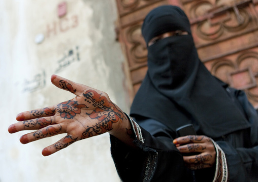 Somali refugee showing her hands tattooed with henna, Mecca province, Jeddah, Saudi Arabia