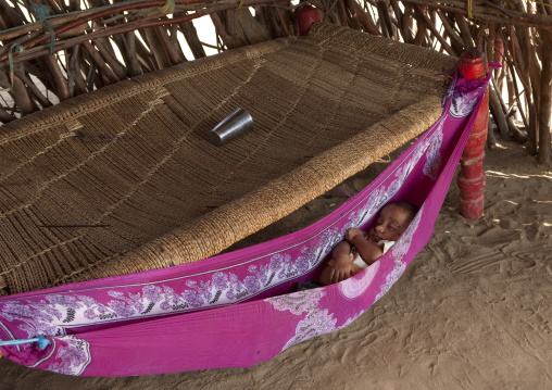 Yemeni refugee baby sleeping in a hammock, Jizan province, Jizan, Saudi Arabia