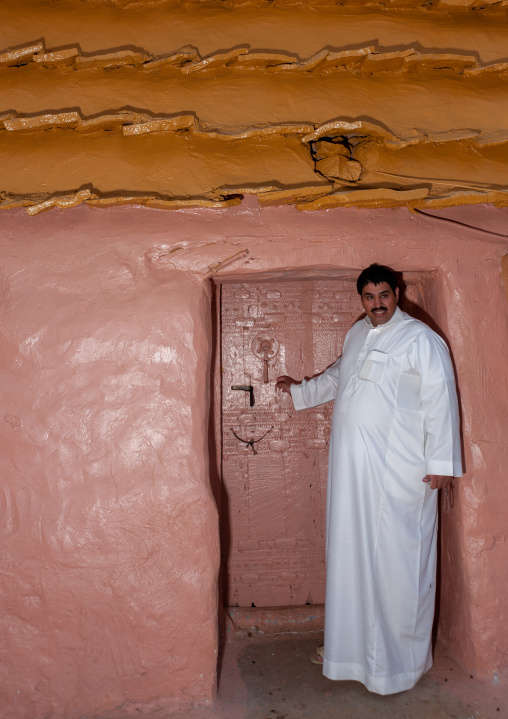 Saudi man in front of his house, Asir Province, Aseer, Saudi Arabia