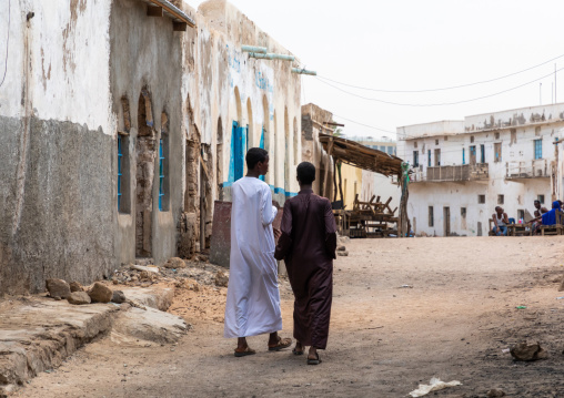 Somali men walking in the old town, Sahil region, Berbera, Somaliland