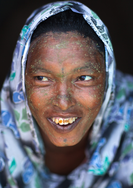 Portrait of a smiling somali woman with qasil on her face, Woqooyi Galbeed region, Hargeisa, Somaliland