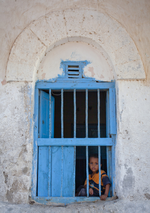 Young Boy Inside The Window Of A Former Ottoman Empire House, Berbera Area, Somaliland