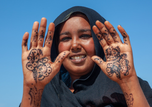 A somali woman showing her hand painted with henna, North-Western province, Berbera, Somaliland
