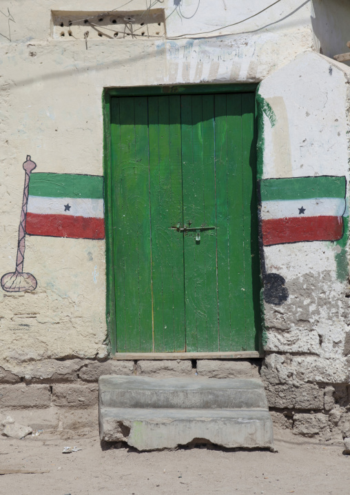 Two Flags Painted On The Wall Around A Green Door, Berbera, Somaliland