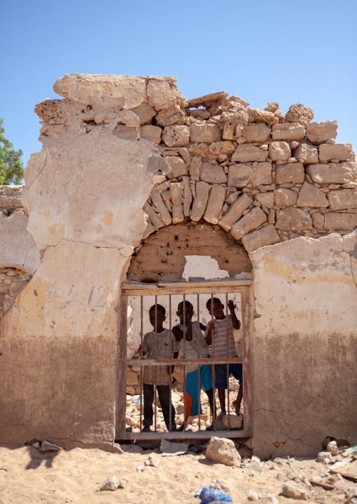 Three somalis boys in the ruins of an old ottoman house, North-Western province, Berbera, Somaliland