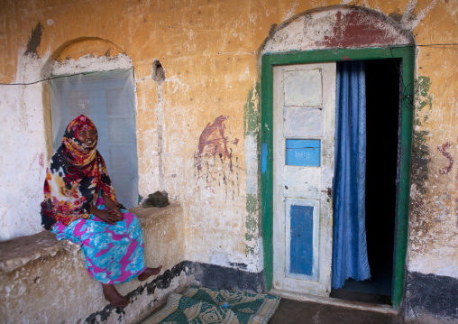 A Woman Wearing Colorful Patterned Clothes In A Former Ottoman Empire House, Berbera Area, Somaliland