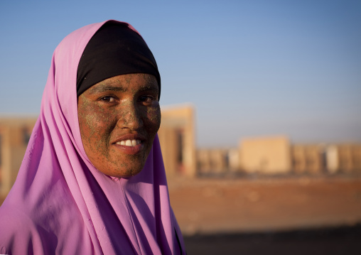 Young Woman With Qasil On Her Face Posing In Front Of The Ruins Of Burao Technology Institute, Burao, Somaliland