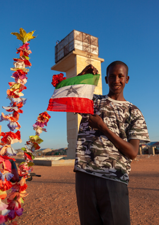 Portrait of a teenage boy with a national flag, Togdheer region, Burao, Somaliland