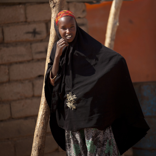 Portrait Of A Smiling Teenage Girl Leaning Against A Tree, Burao, Somaliland