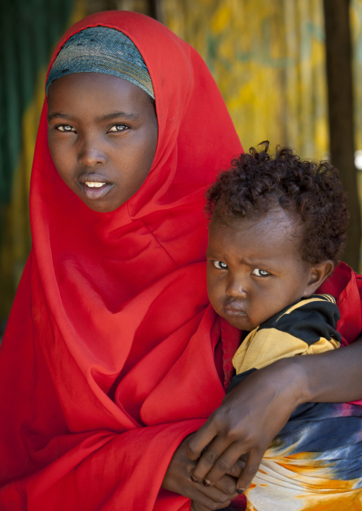 Portrait Of A Young Girl Holding A Small Child, Burao, Somaliland