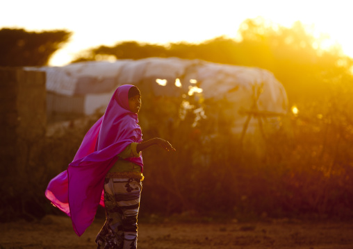 A Woman Wearing A Pink Hijab Floating In The Wing At Sunset, Baligubadle, Somaliland