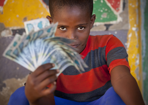 Smiling Young Boy With Bank Notes In His Hand, Somaliland