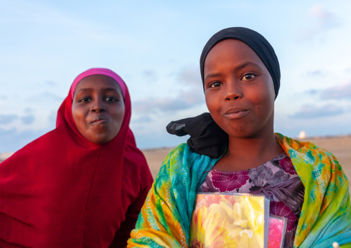 Portrait of somal girls with a school books, Awdal region, Zeila, Somaliland