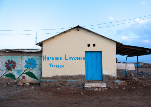 Advertisement for telesom on the wall of a modern house, Awdal region, Zeila, Somaliland