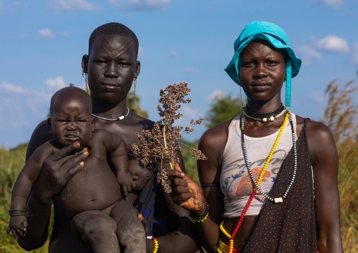 Portrait of Mundari tribe women with a child, Central Equatoria, Terekeka, South Sudan