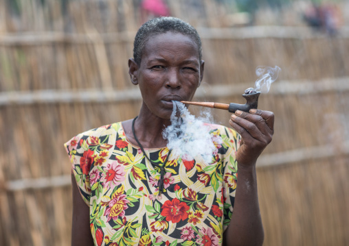 Portrait of a Larim tribe woman smoking a pipe, Boya Mountains, Imatong, South Sudan