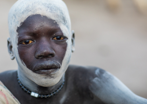 Mundari tribe boy covered in ash to protect from the mosquitoes and flies, Central Equatoria, Terekeka, South Sudan
