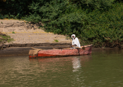 Fisherman in a boat on river Nile, Northern State, El-Kurru, Sudan