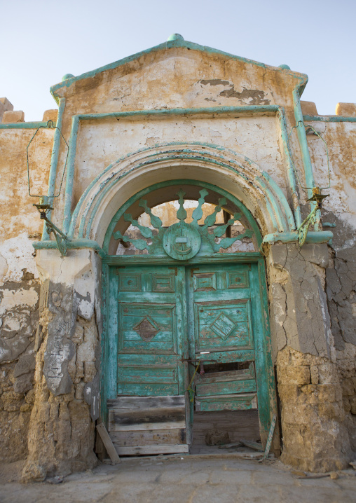 Sudan, Port Sudan, Suakin, huge green door of a ruined ottoman coral buildings
