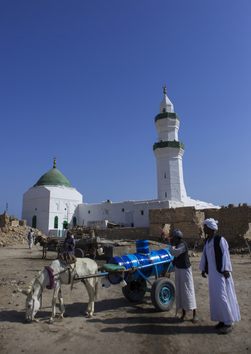 Sudan, Port Sudan, Suakin, man with a cart and a donkey in front of taj es-sir mosque on mainland el-geyf