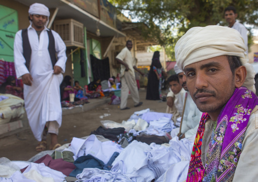 Sudan, Kassala State, Kassala, rashaida tribe men selling clothes