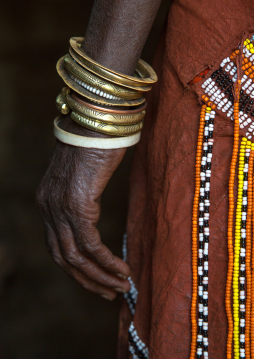 Tanzania, Serengeti Plateau, Lake Eyasi, the numerous decorated iron, brass, copper and leather bracelets worn by a datoga woman