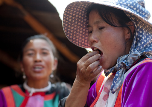 Lisu tribe women eating, Ban nam rin village, Thailand