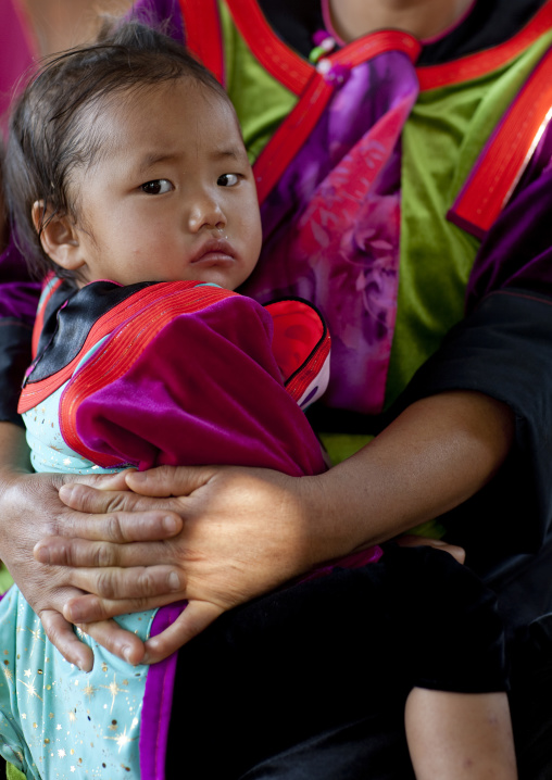 Baby with her mother in ban nam rin village, Lisu tribe, Thailand