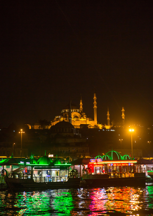 Galata bridge restaurants with Suleymaniye mosque in the back at night, Marmara Region, istanbul, Turkey