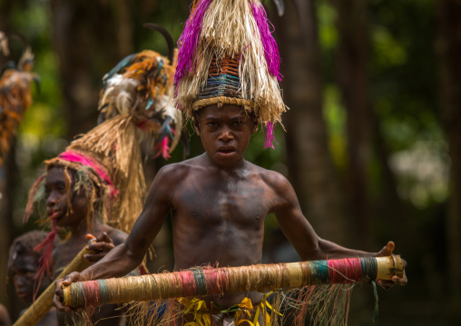 Small Nambas children with Big headdresses dancing during the palm tree dance, Malekula island, Gortiengser, Vanuatu