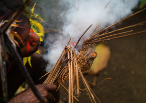 Small Nambas tribe man starting a fire, Malekula island, Gortiengser, Vanuatu