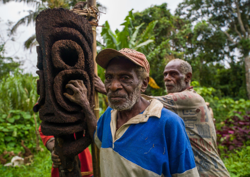 Ni-Vanuatu statue carvers working in the forest on a fern tree, Malampa Province, Malekula Island, Vanuatu