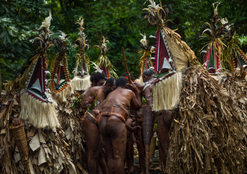 Tribesmen dressed in colorful masks and costumes made from the leaves of banana trees performing a Rom dance, Ambrym island, Fanla, Vanuatu