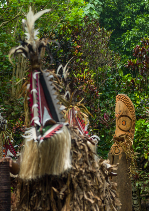 Rom dance masks and giant slit drum during a ceremony, Ambrym island, Fanla, Vanuatu