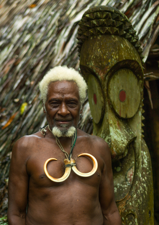Portrait of chieftain Jean-Denis with a necklace of wild pig tusks, Ambrym island, Olal, Vanuatu