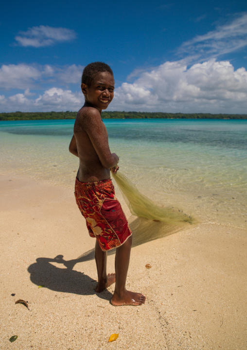 Young boy of the Ni-Vanuatu people with his fishing net, Sanma Province, Espiritu Santo, Vanuatu