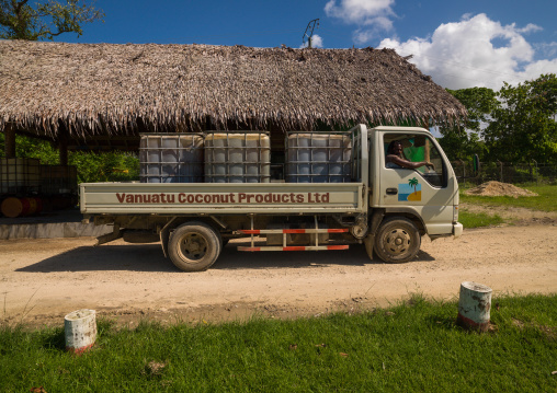 Truck carrying coconut oil barrels produced as an alternative fuel energy, Espiritu Santo, Luganville, Vanuatu