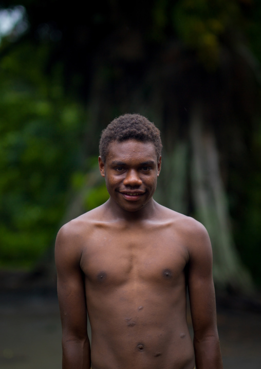 Teenager standing in the middle of the ceremonial square, Tanna island, Yakel, Vanuatu