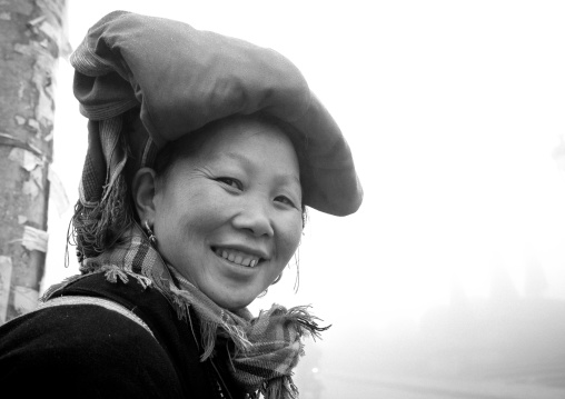 Smiling red dzao woman with traditional headgear, Sapa, Vietnam
