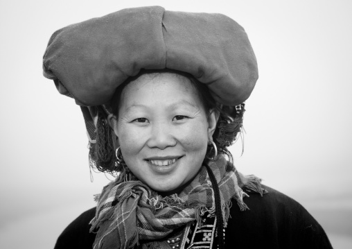 Smiling red dzao woman with traditional headgear, Sapa, Vietnam