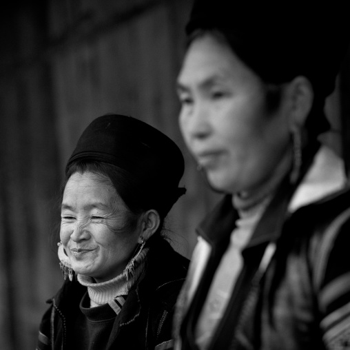 Black hmong women with traditional hat and earrings, Sapa, Vietnam