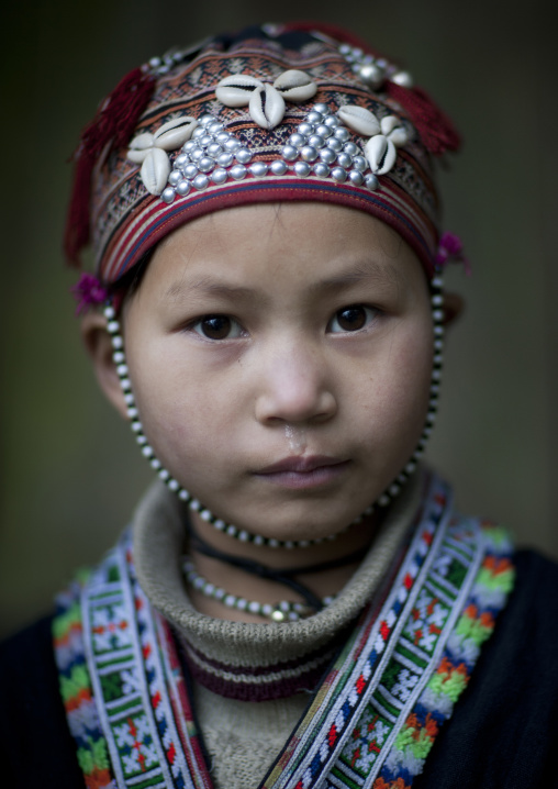 Young red dzao girl with a traditional hat, Sapa, Vietnam