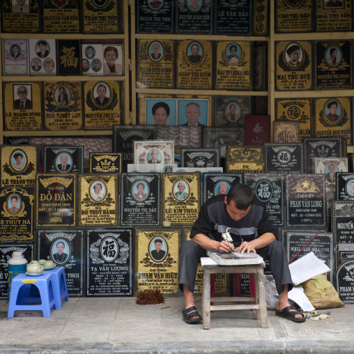 Man engraving a gravestone, Hanoi, Vietnam