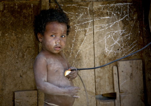 Amran Poor Kid Holding A Small Piece Of Bread And An Electric Wire, Amran, Yemen