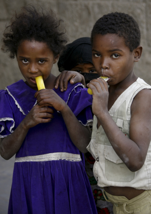 Black Amran Kids Eating Stick Popsicle, Amran, Yemen