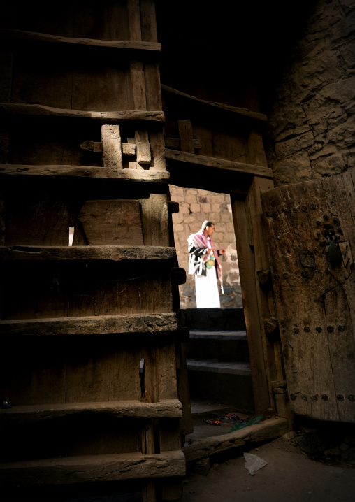 Man Speaking In The Street Seen From The Interior Of A House, Behind A Heavy Wooden Door, Sanaa, Yemen